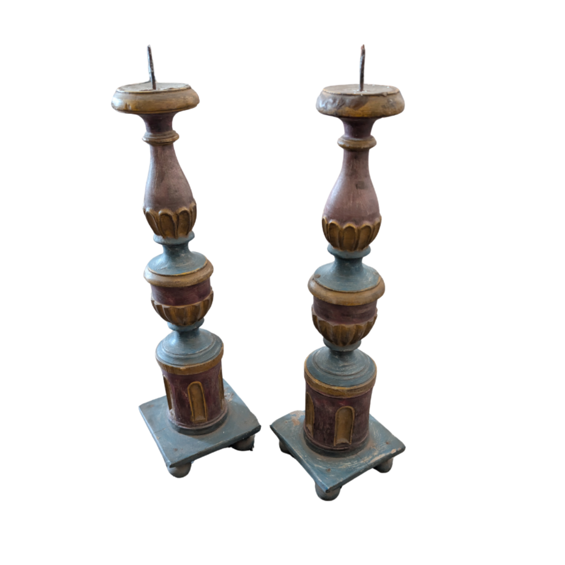 Two wooden candle holders on a white background