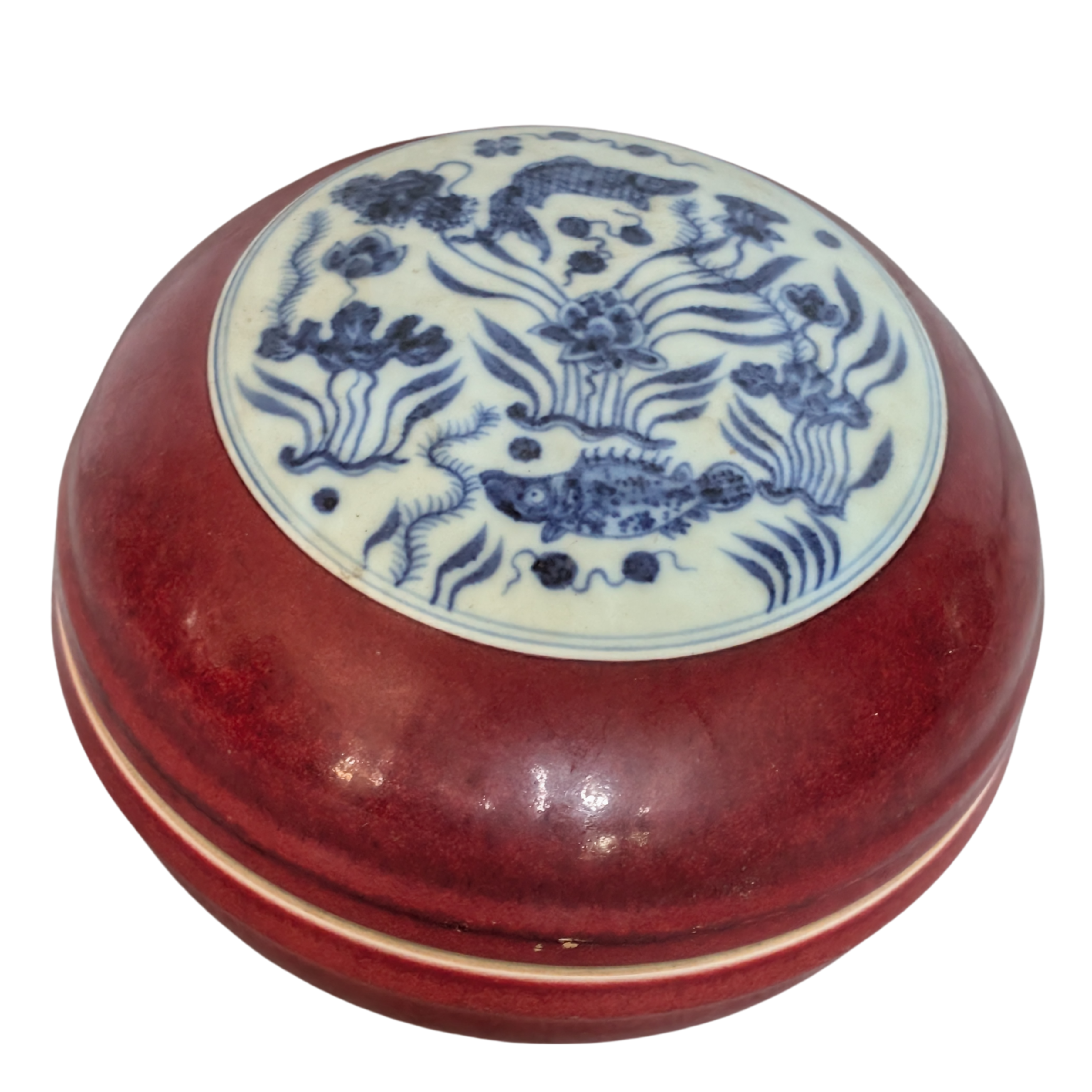 Round ceramic box with blue floral patterns on a white background