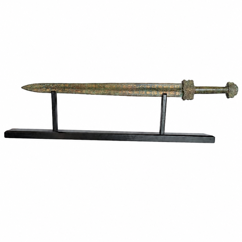 Bronze sword on a stand against a white background