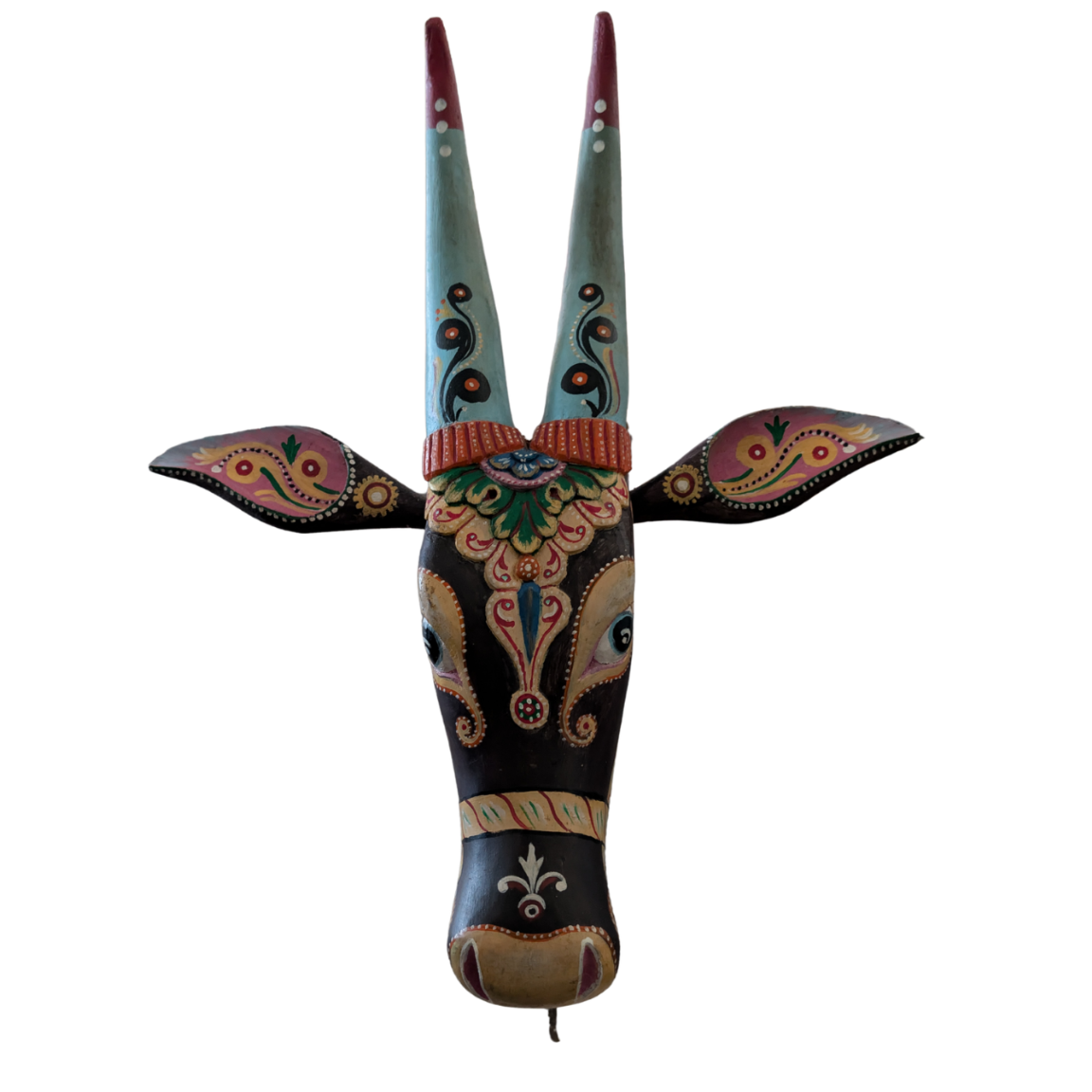 Decorative wall art of a stylized animal head with long horns on a white background
