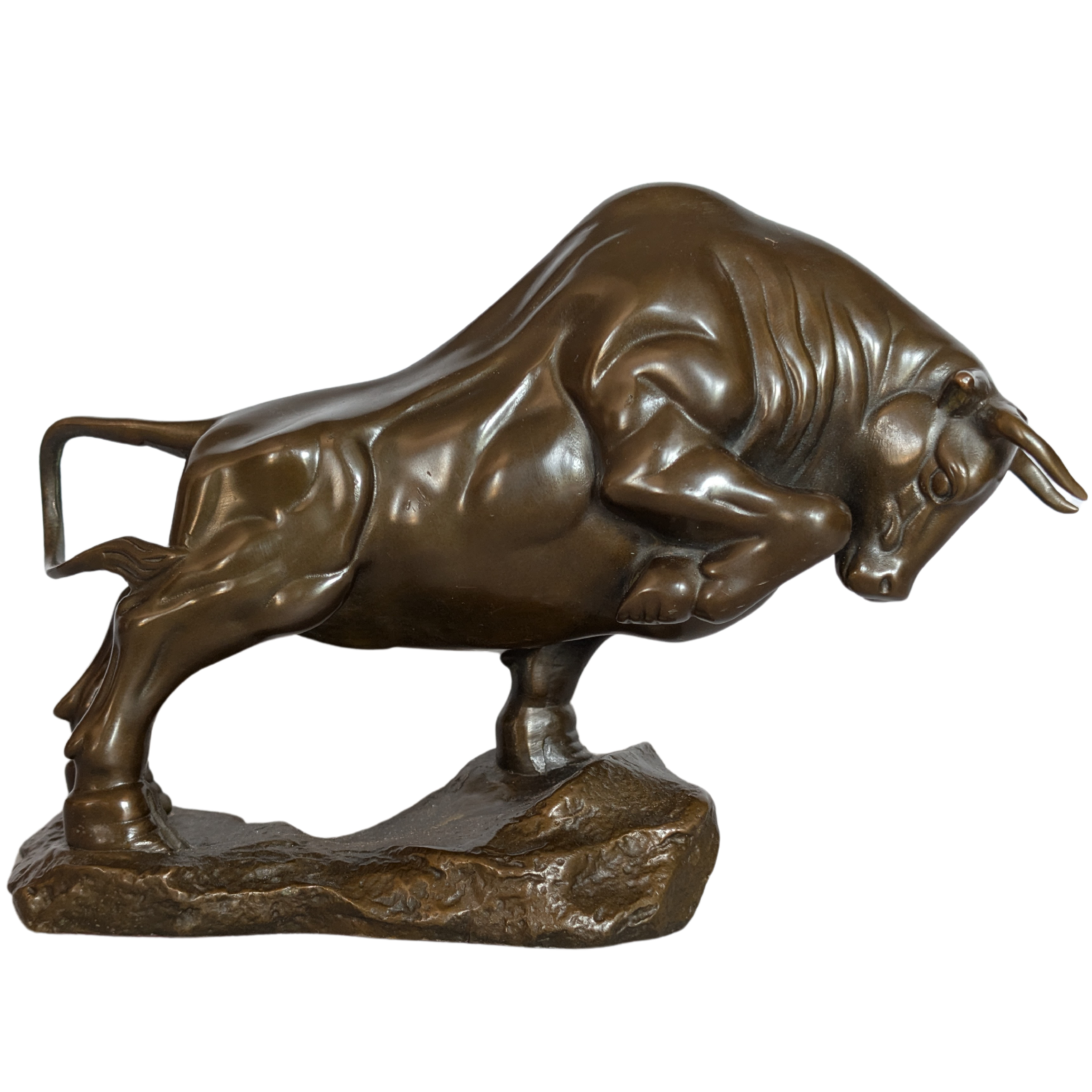 Bronze statue of a charging bull on a white background