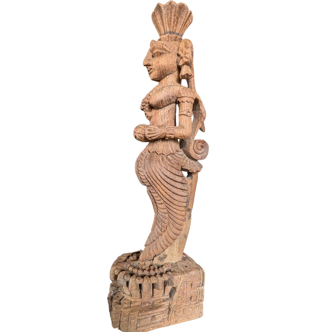 Wooden sculpture of a figure with intricate details on a white background