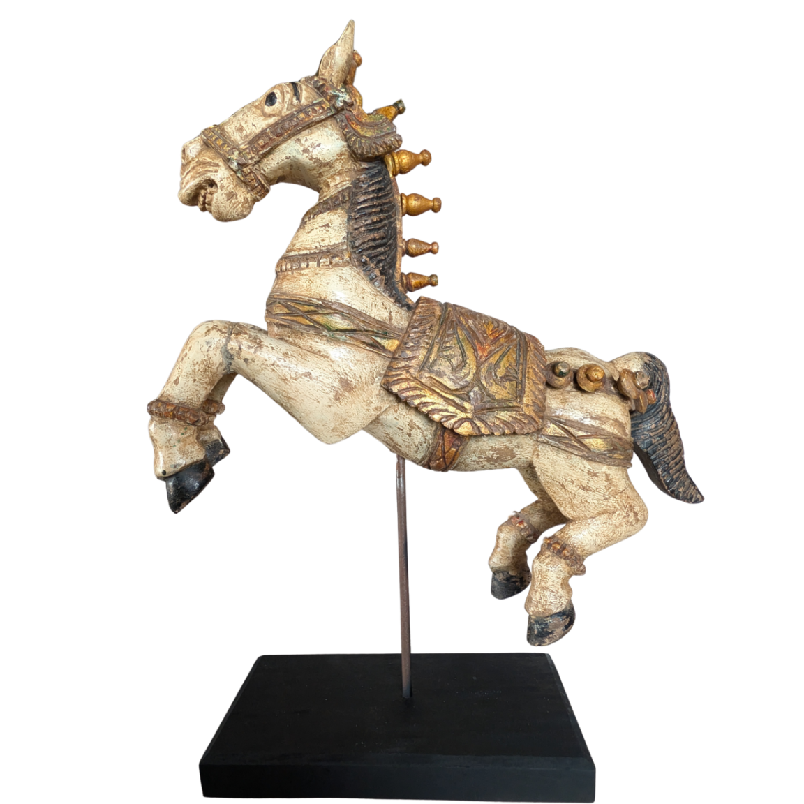 Decorative horse figure on a stand with intricate details against a white background
